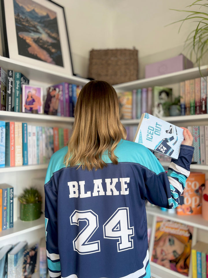 a person standing in front of a book shelf
