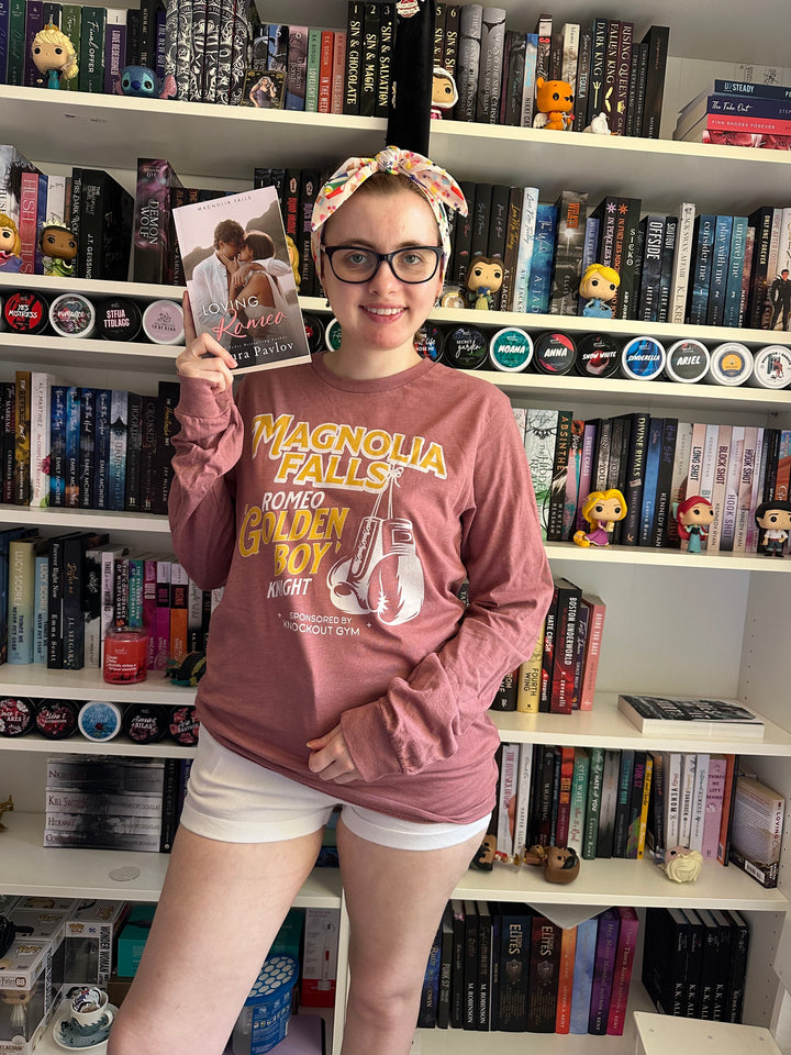 a woman standing in front of a book shelf