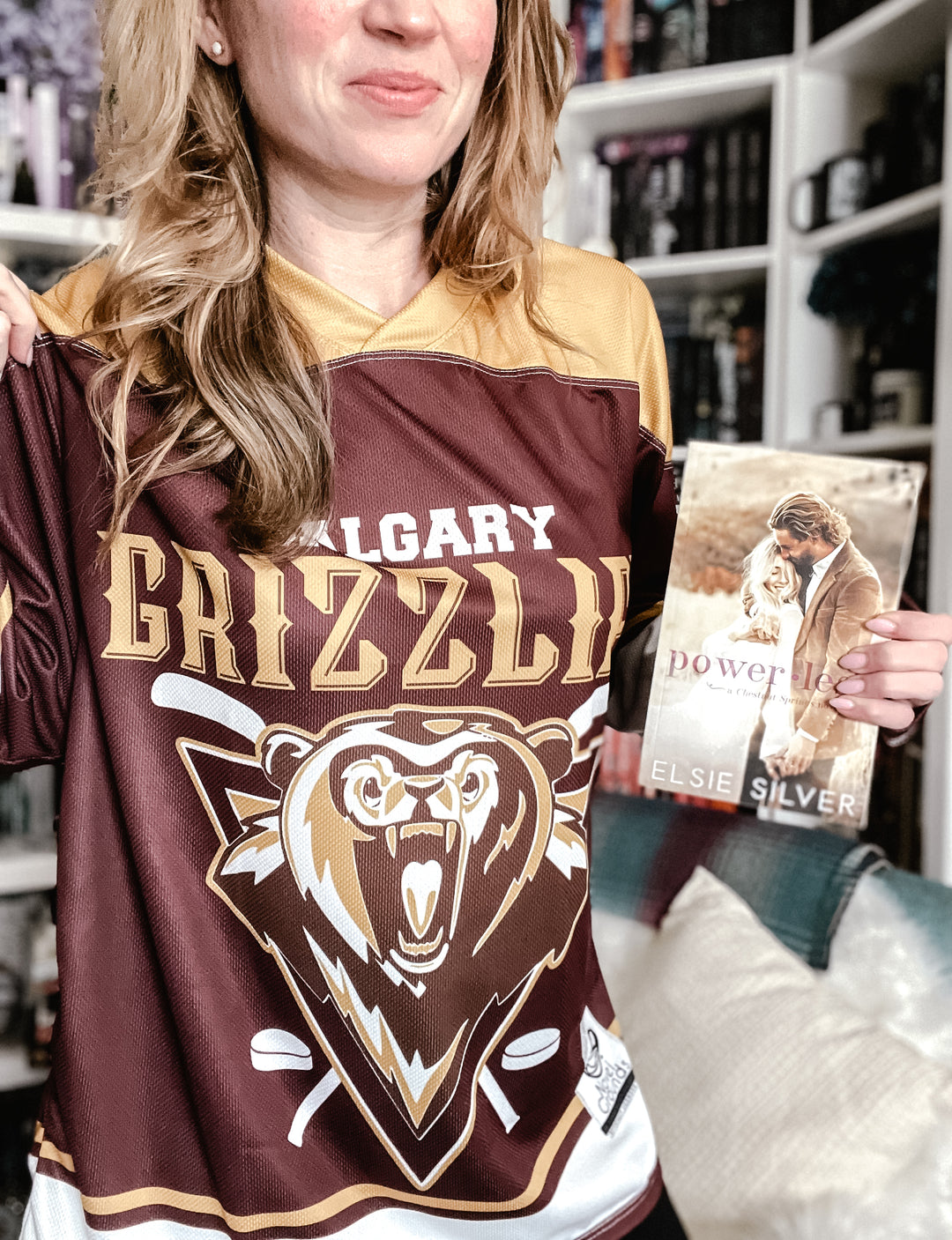 a woman holding a book in her hands