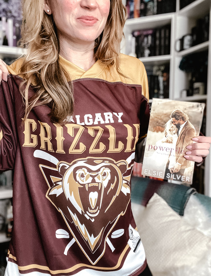 a woman holding a book in her hands