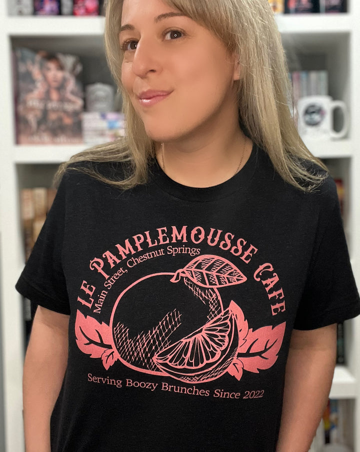 a woman with blonde hair wearing a black shirt