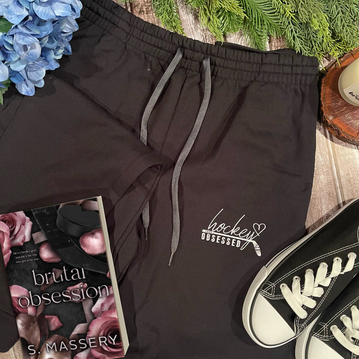 a pair of sneakers and a book on a table