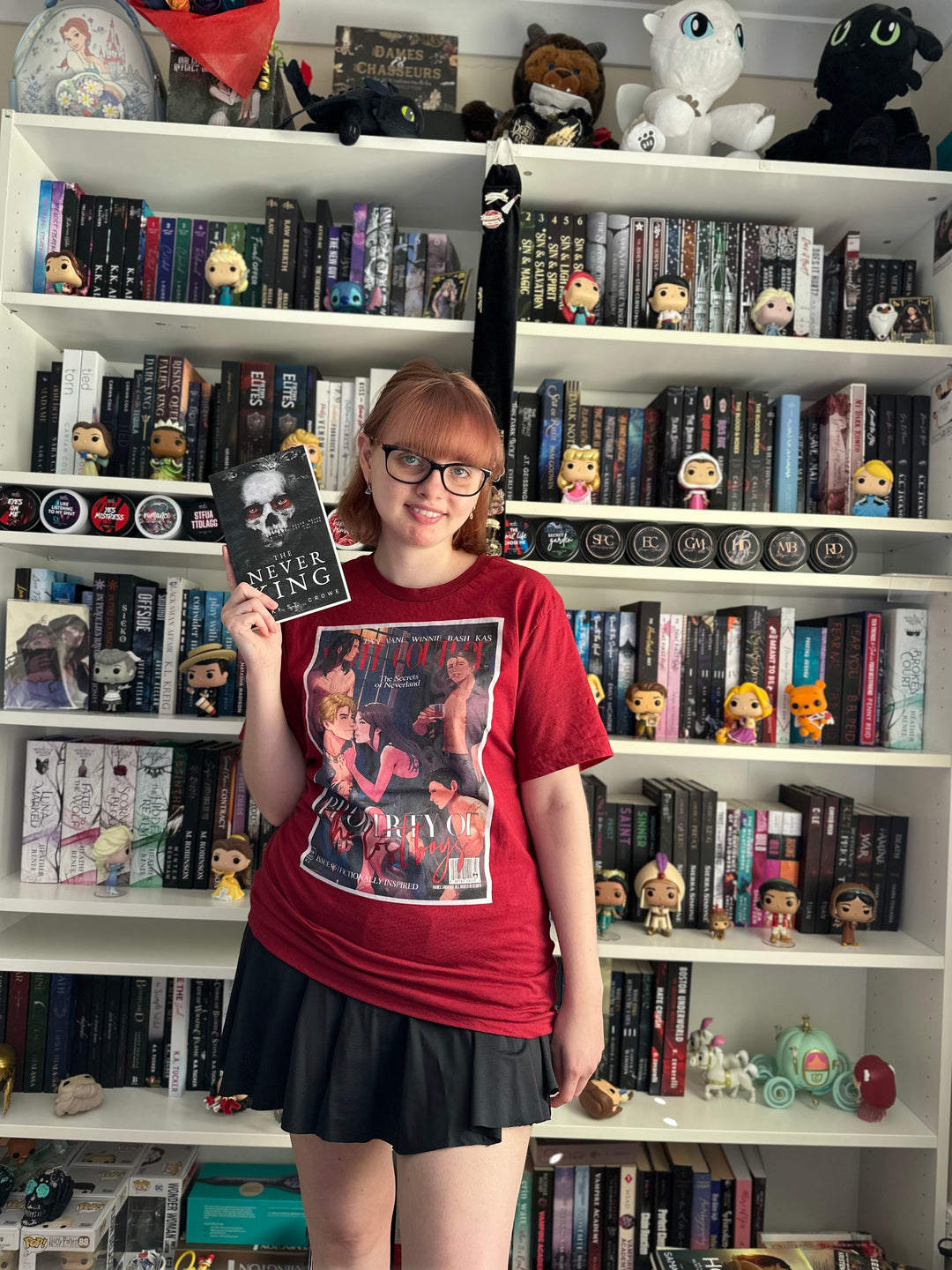 a woman standing in front of a book shelf