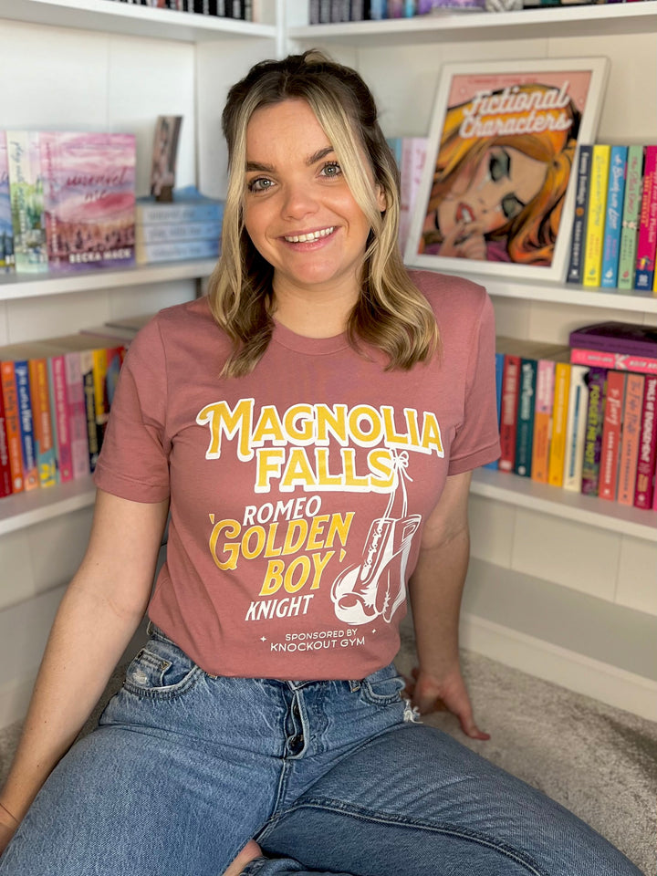 a woman sitting on a chair in front of a bookshelf