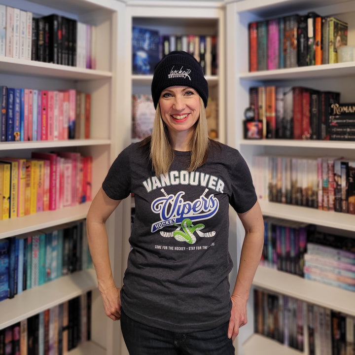 a woman standing in front of a book shelf