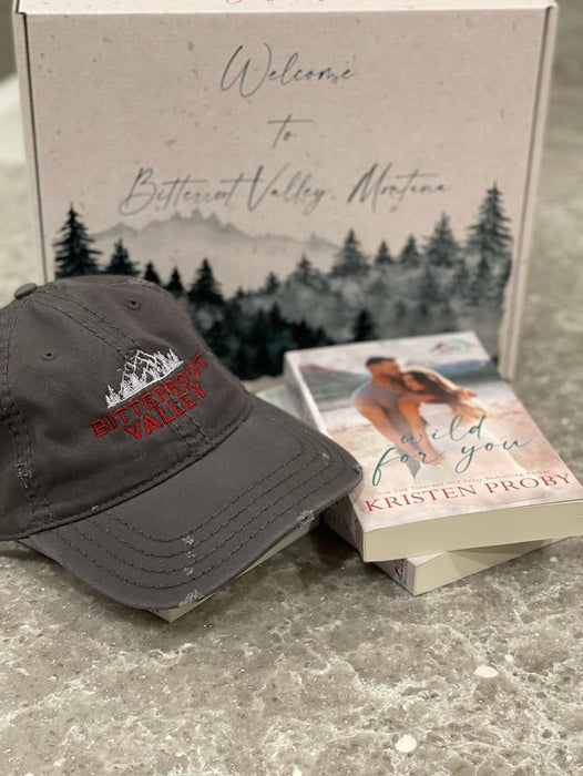 a hat and a book sitting on a table