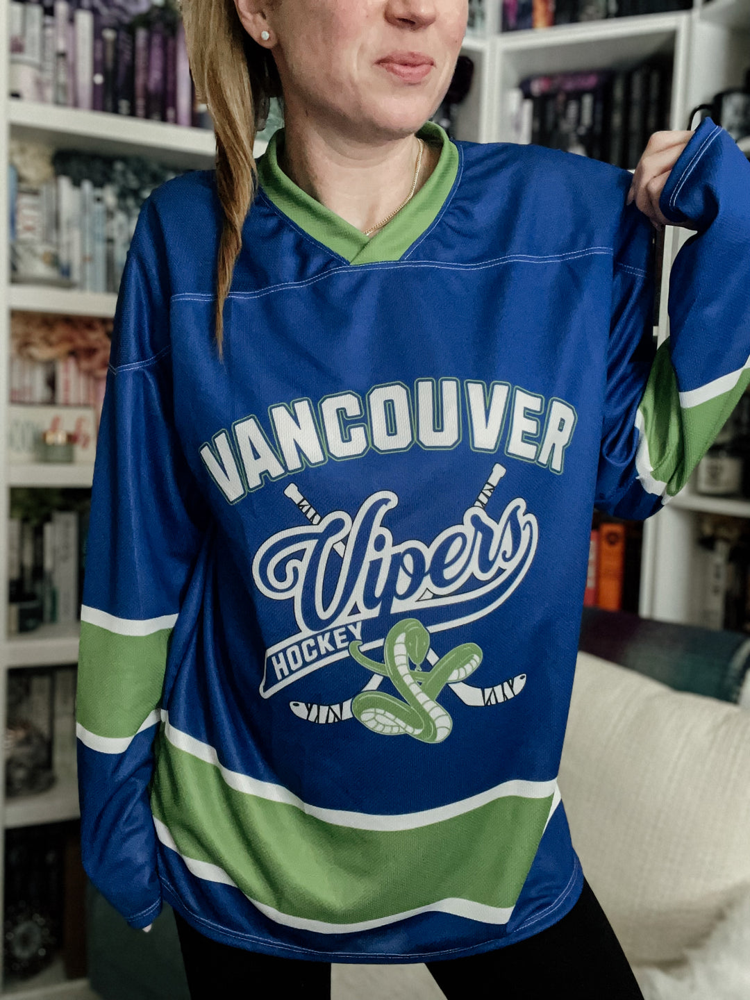 a woman in a vancouver uppers hockey jersey